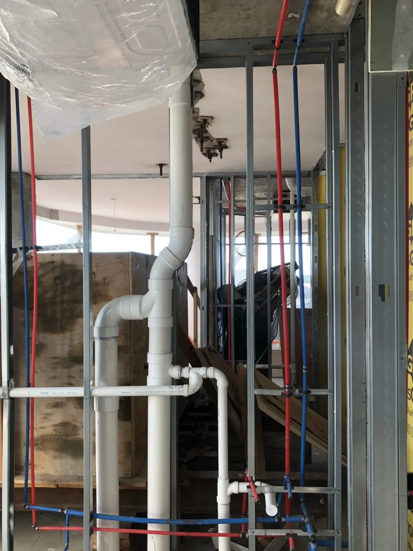 Rough in plumbing inside a framed wall